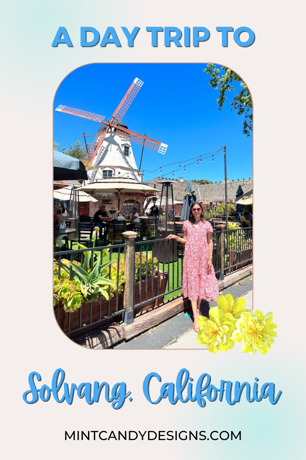 A lady standing in front of windmill in Solvang, California